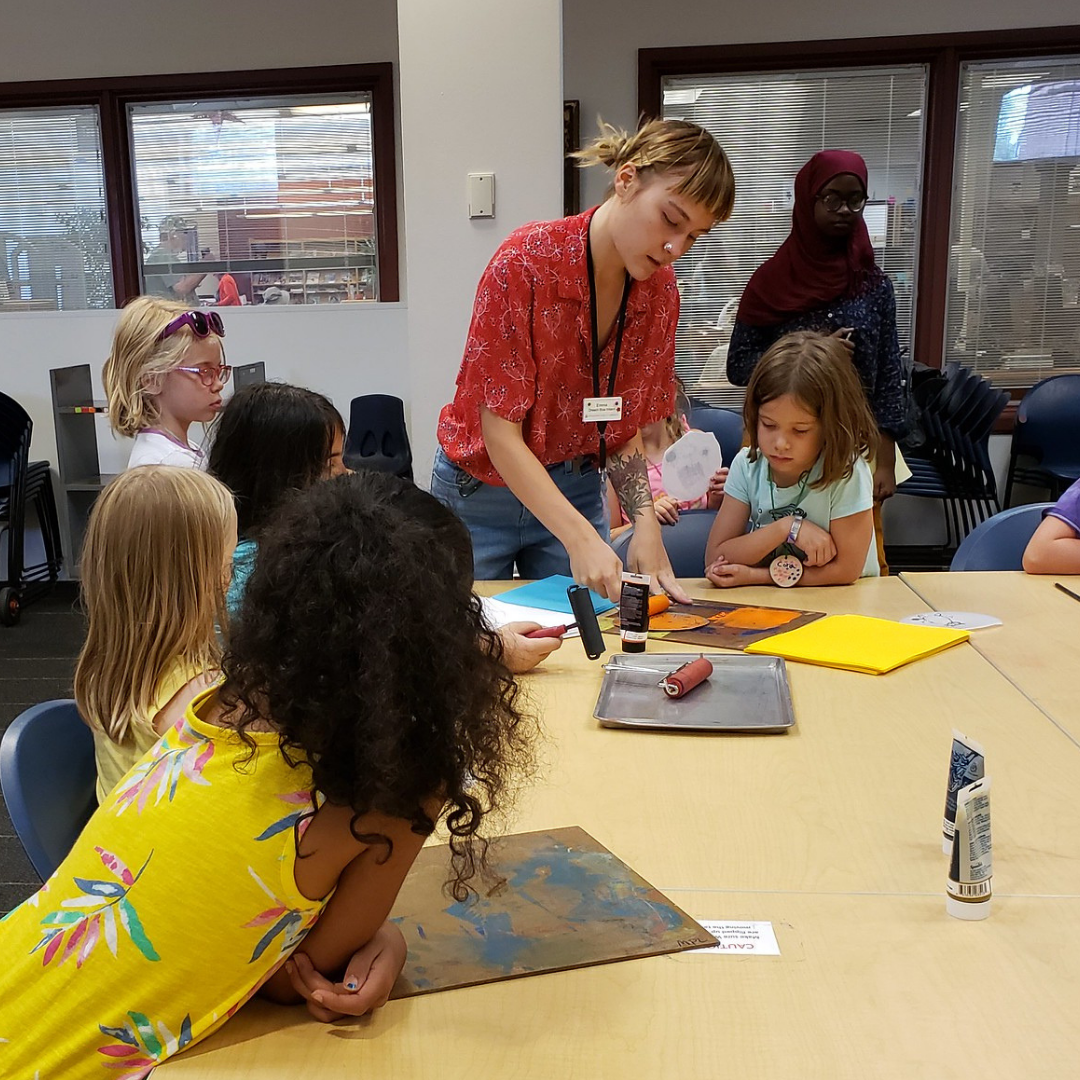 Kids gather around to learn foam block printing Kids gather around to learn foam block printing