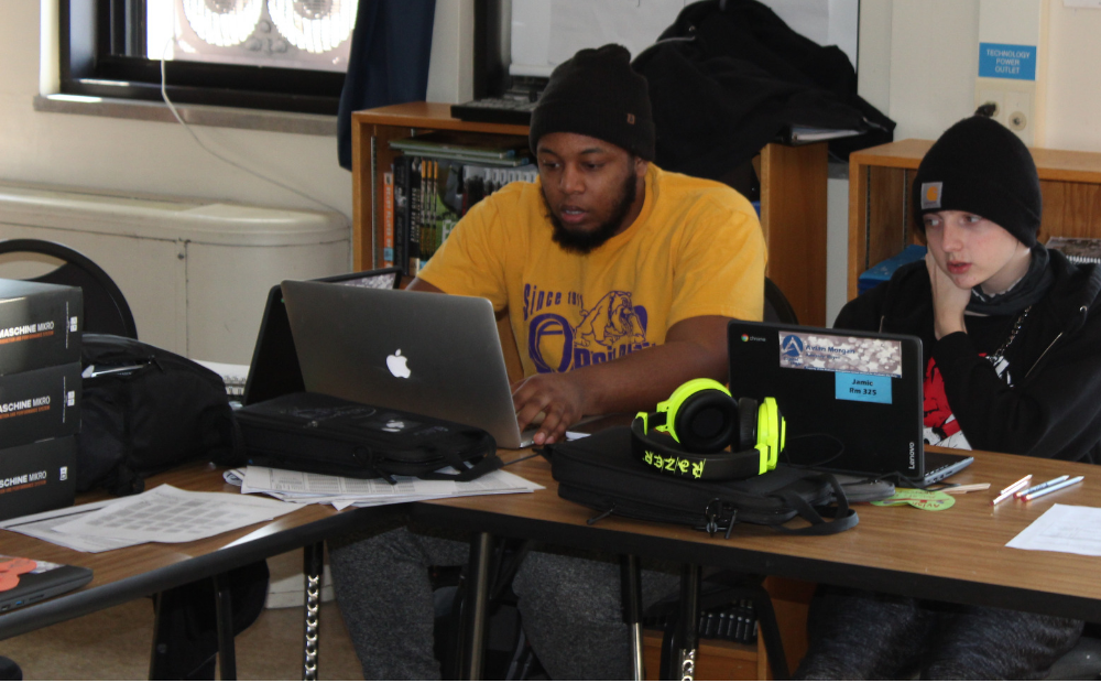 Richard Jones of Oddly Arranged Media and Capital High Student work on audio editing Richard Jones of Oddly Arranged Media and Capital High Student work on audio editing