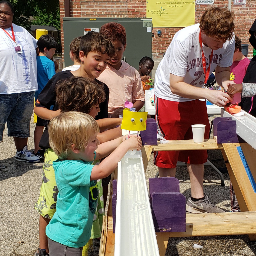 Kids launch their boats during the Bubbler Regatta Kids launch their boats during the Bubbler Regatta