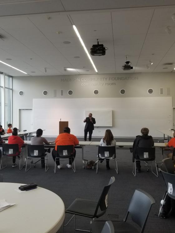 MPL Community Room.jpg Students sitting at tables set in a U Shape facing a speaker