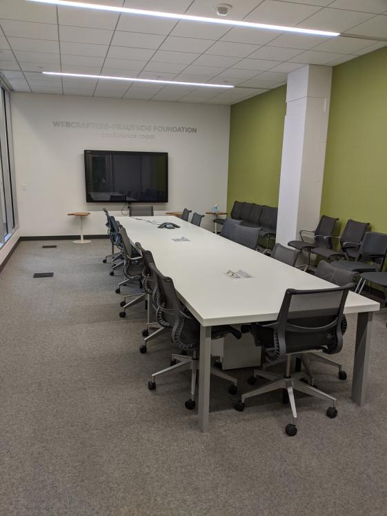 conference room with long table and 15+ chairs around it