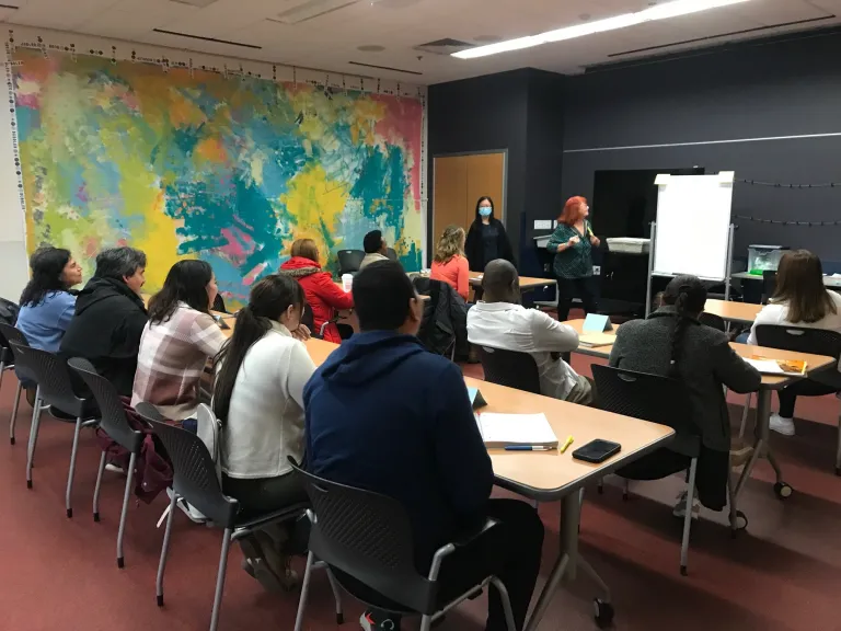 A full class of students attend a literacy course at Goodman South
