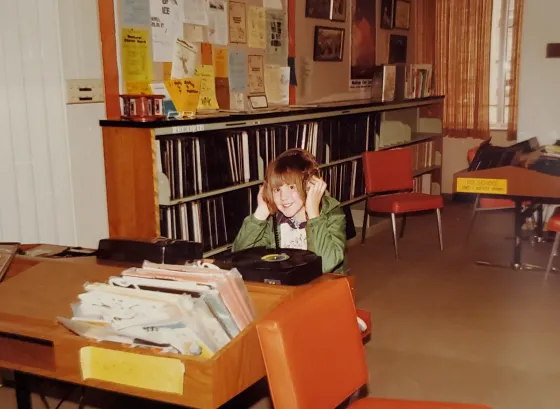 vinyl-record-listening-cropped.png teenager listening to a vinyl record