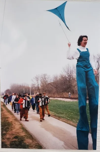Earth Day celebration with stilts leading parade followed by accordians Pinney Library History.PNG Earth Day celebration with stilts leading parade followed by accordians Pinney Library History Madison Public Library
