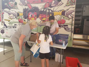 dream bus 4.jpg Kids pick out books at the Dream Bus
