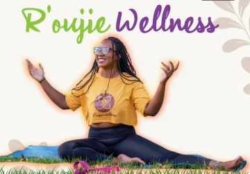 Owner of R'oujie Wellness Keena Atkinson strikes a yoga pose