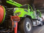 Photograph of Vactor, the big green truck used to clean and maintain sewage systems Photograph of Vactor, the big green truck used to clean and maintain sewage systems