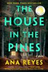 The cover of The House in the Pines by Ana Reyes, with a ghostly key superimposed over a night scene of a cabin in a forest. The cover of The House in the Pines by Ana Reyes, with a ghostly key superimposed over a night scene of a cabin in a forest.
